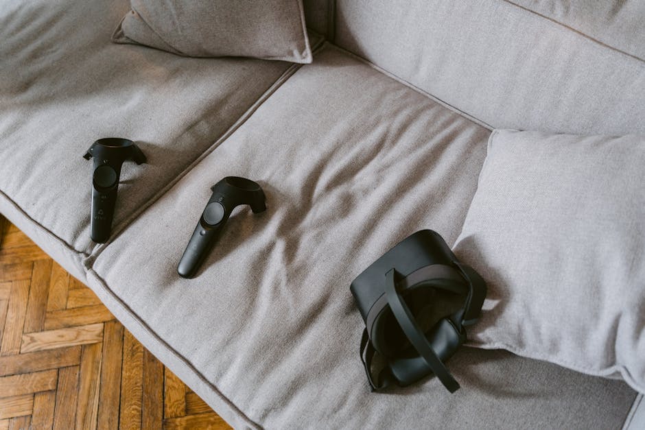 VR headset and controllers placed on a comfortable beige sofa.